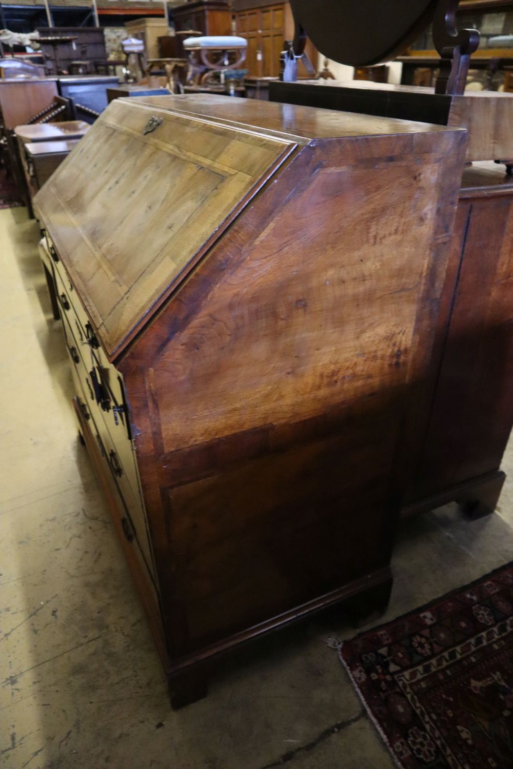 A Georgian style walnut and cross-banded bureau, width 107cm depth 54cm height 110cm